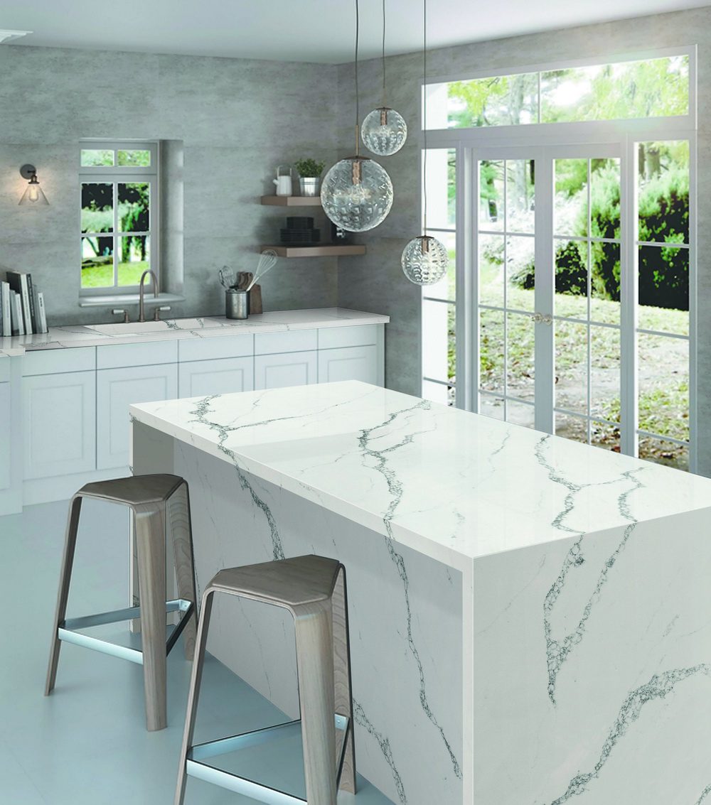 white quartz waterfall kitchen island with grey veining